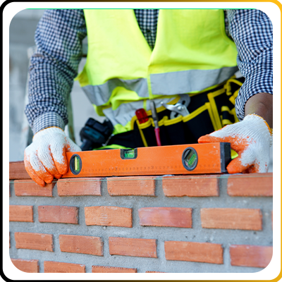 A builder working on a wall