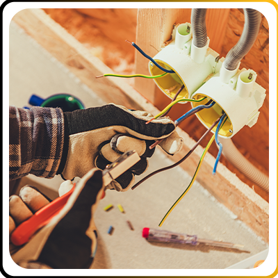 An electrician working on wiring