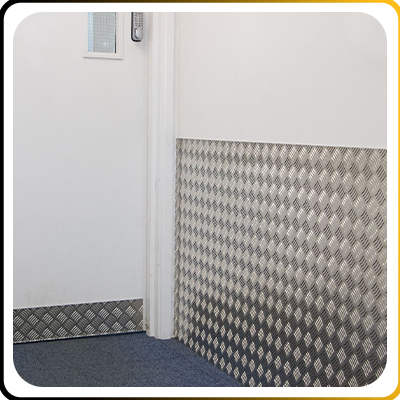 hotel corridor with a metal wall protector