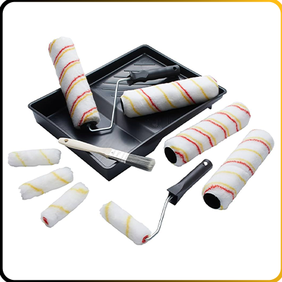 paint rollers and a tray on a white background