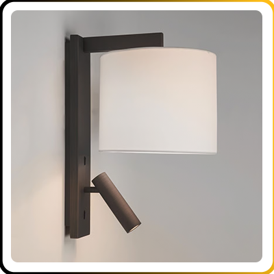A wall with a bronze body and cream shade on a grey wall